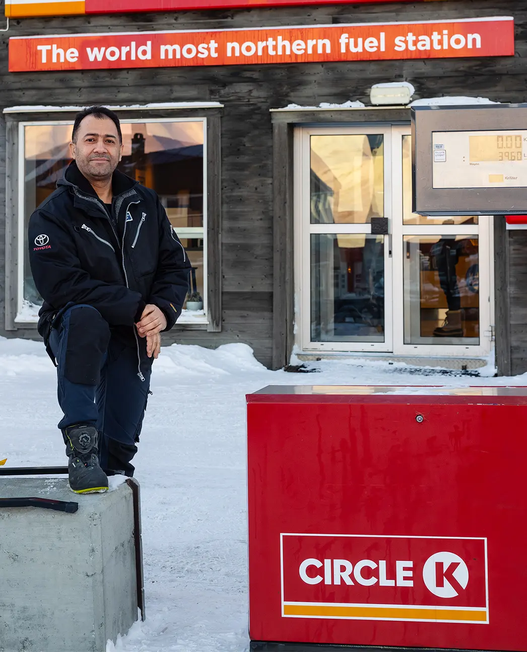 Omid Abolhasani in front of petrol station