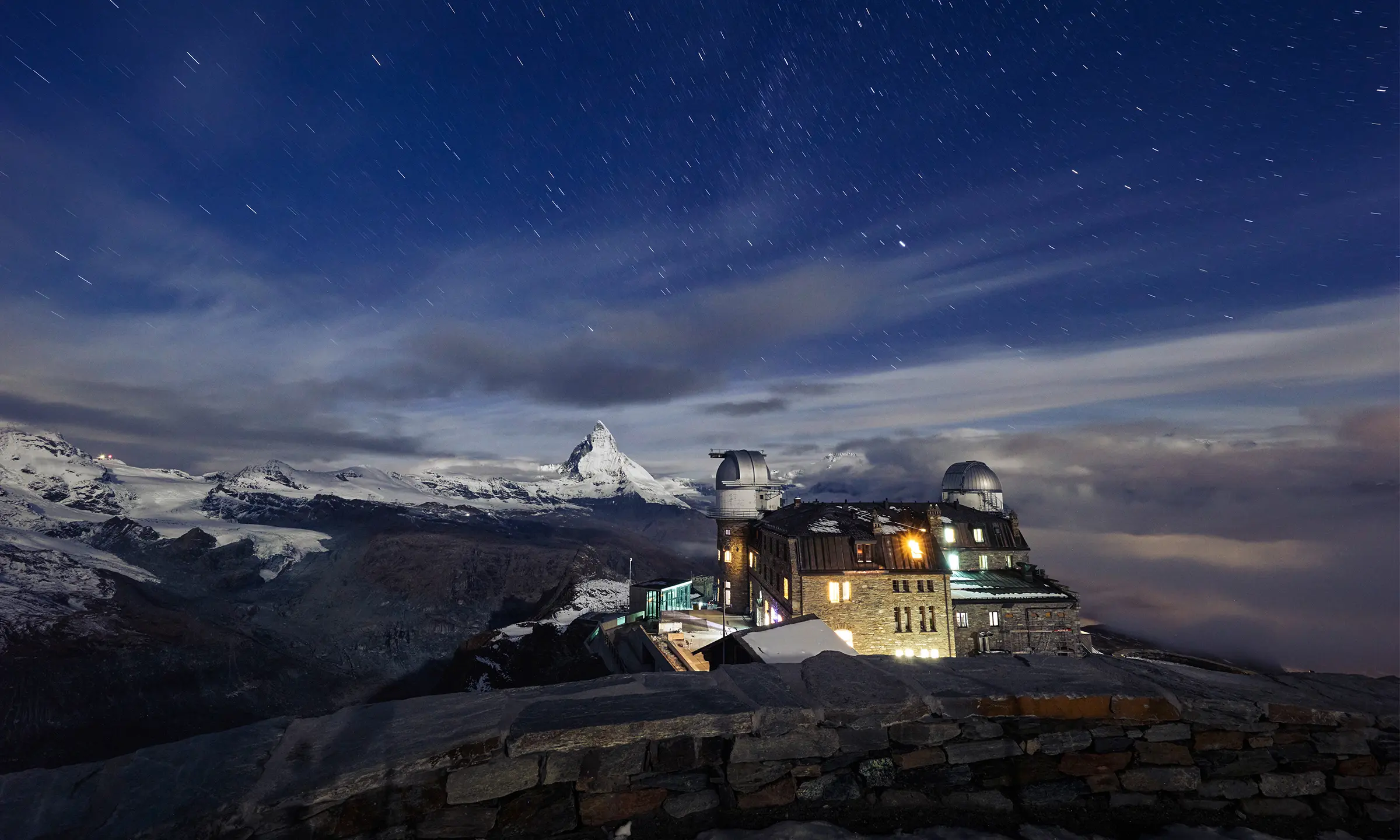 Hotel with observatory and night sky